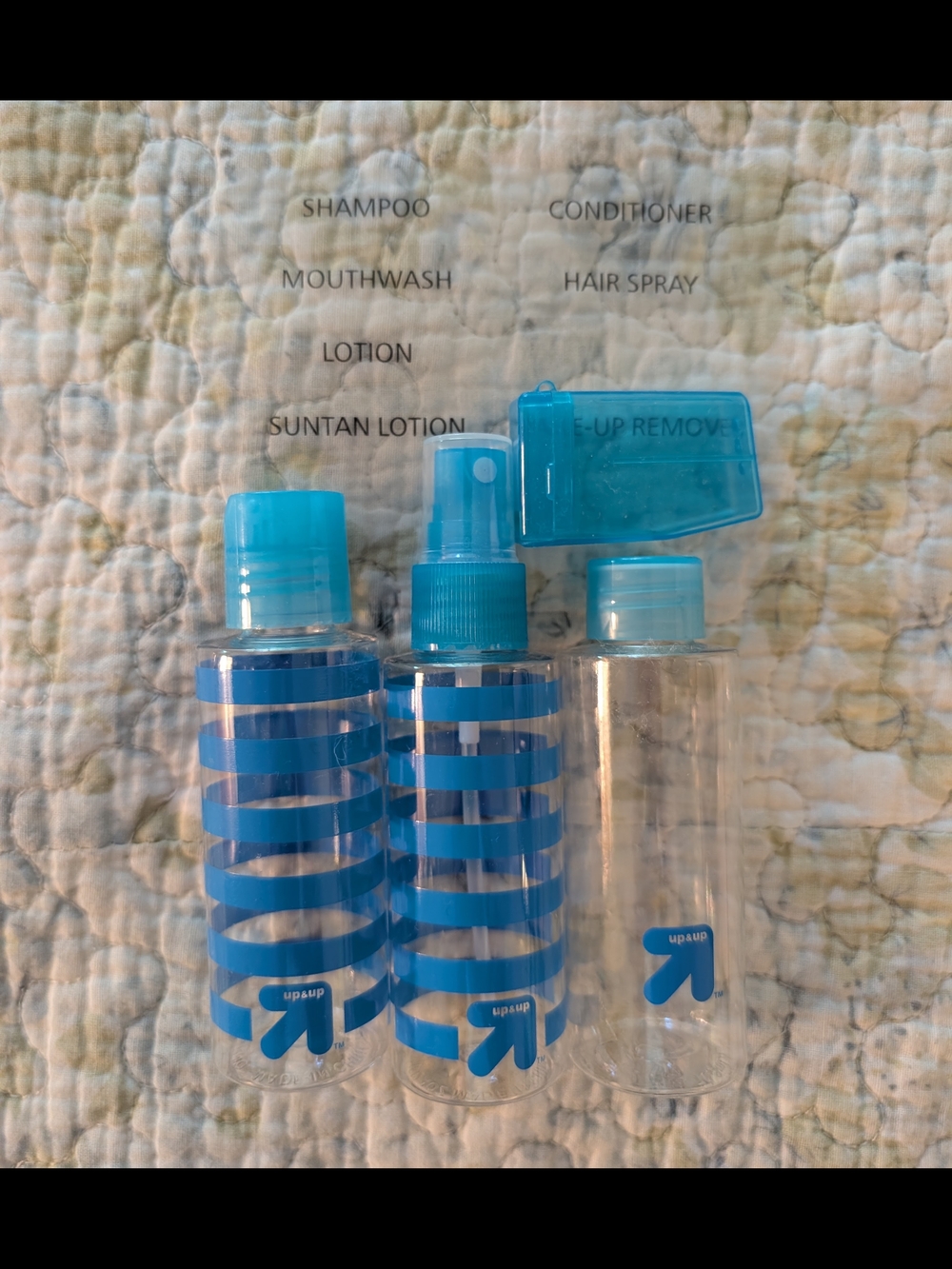Clear Travel Toiletry Bottles with Blue Accents